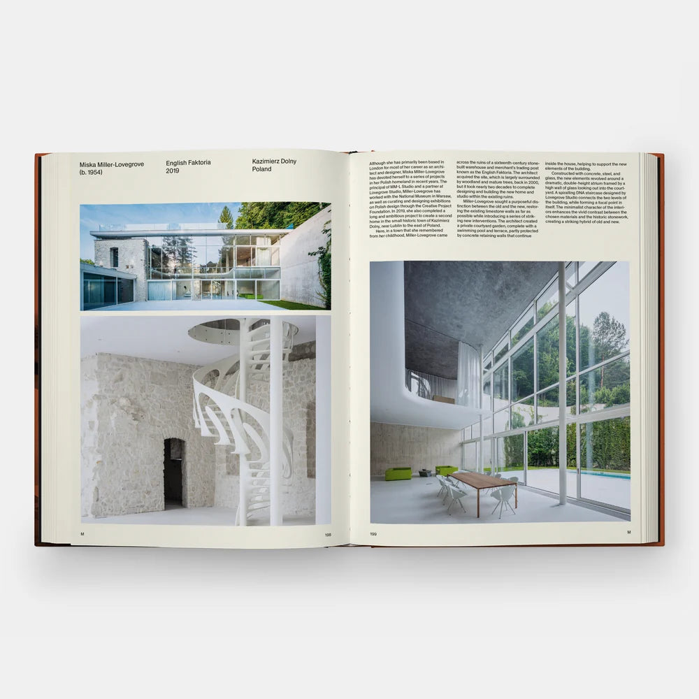 An open architectural book spread showing two interior design photographs and columns of text on cream pages, photographed against a light gray background.