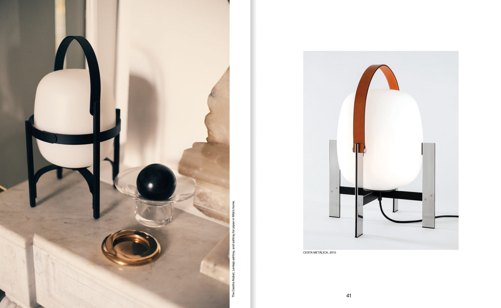 Two different designs of table lamps on a marble surface with a white background.